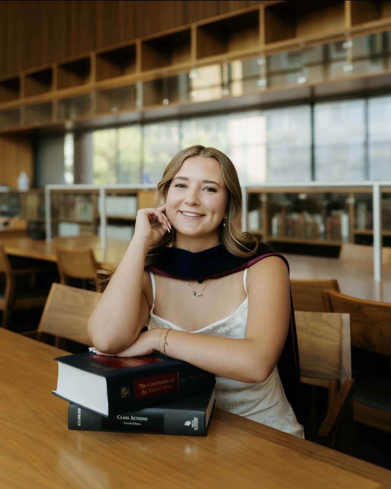 Aliza Lewis, class action plaintiff attorney, in the law library